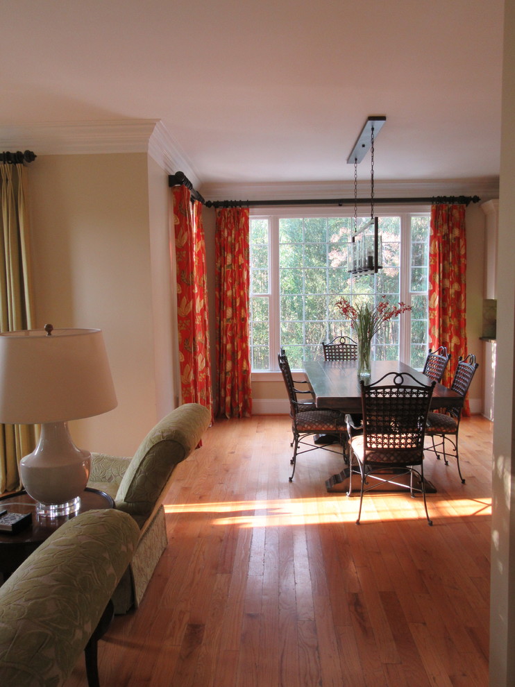 Mid-sized transitional medium tone wood floor and beige floor great room photo with beige walls and no fireplace