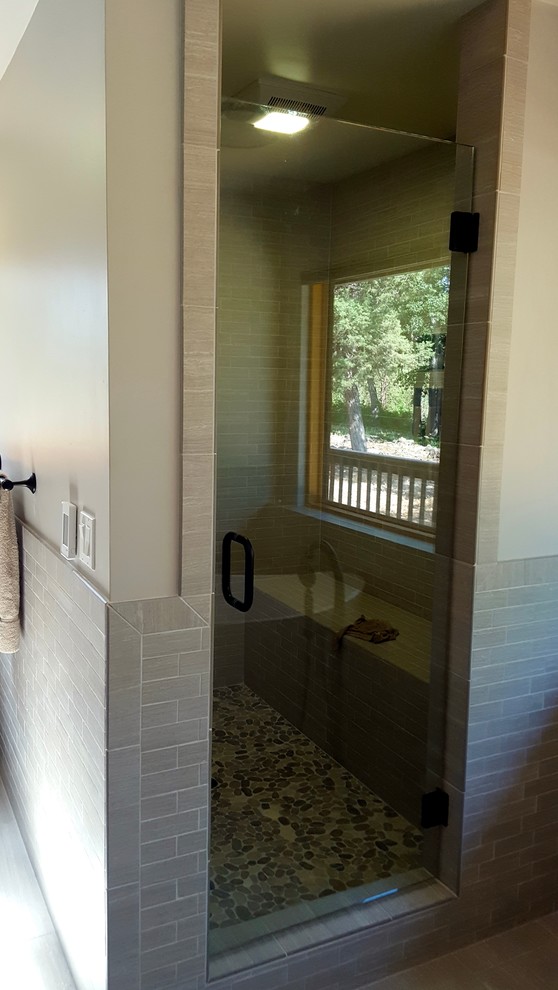 Home design - large rustic master gray tile and ceramic tile ceramic tile home design idea with shaker cabinets, medium tone wood cabinets, a one-piece toilet, gray walls, a drop-in sink and granite countertops