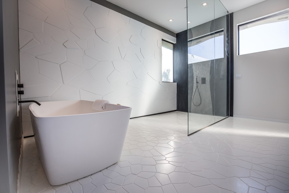 Photo of a large modern master bathroom in Los Angeles with an open shower, white tile, white walls and white floor.