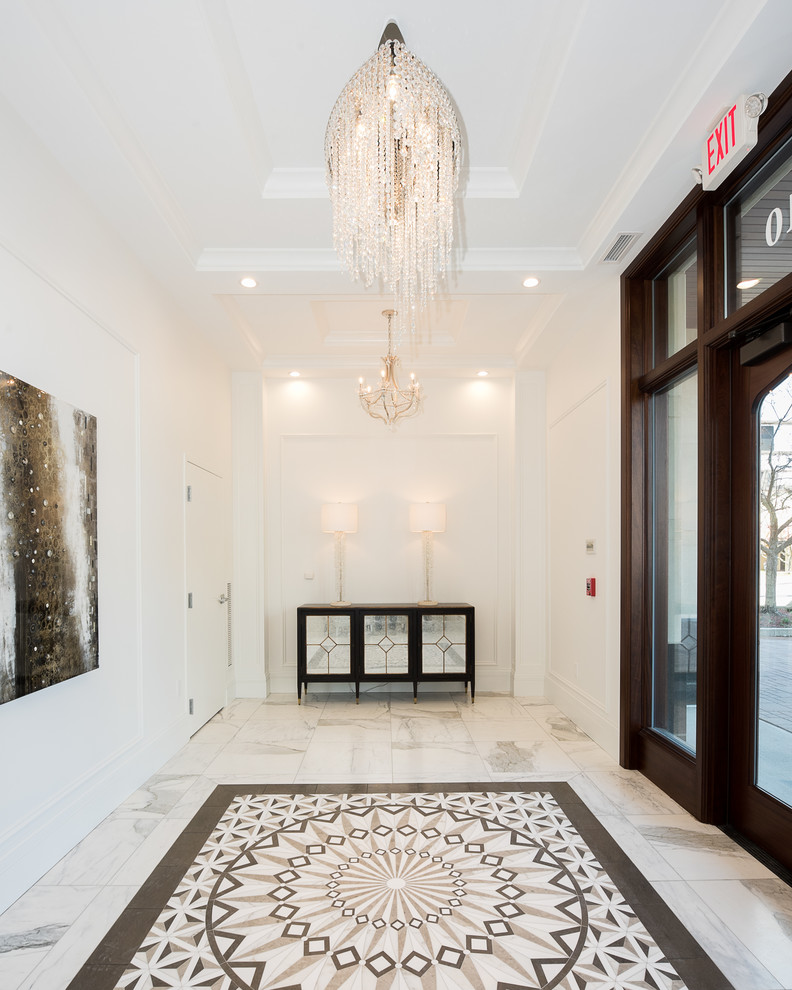 Example of a transitional marble floor and white floor single front door design with white walls and a dark wood front door