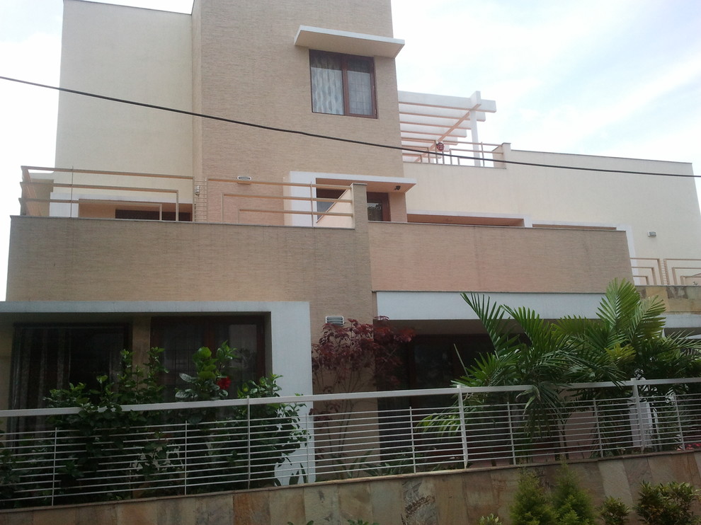 Example of a trendy home design design in Bengaluru
