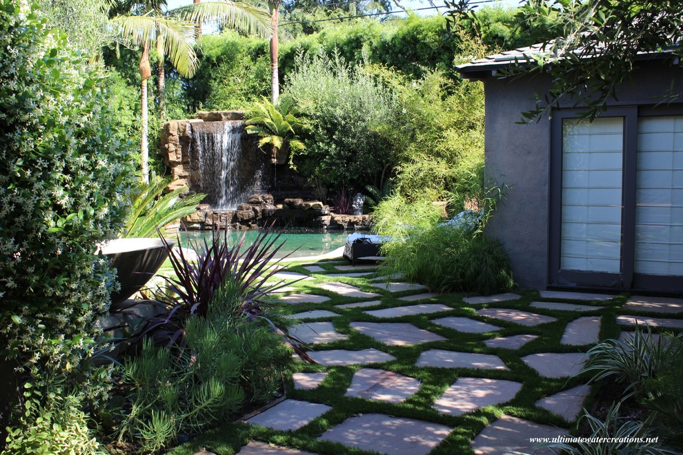Studio City - Naturalistic rockwork pool with waterfalls and remodeled backyard