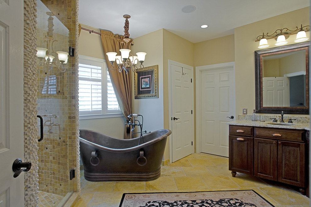 Inspiration for a traditional bathroom in DC Metro with a freestanding tub and granite benchtops.