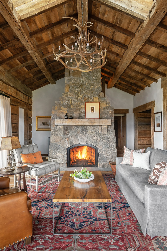 This is an example of a country formal living room in Other with grey walls and a standard fireplace.