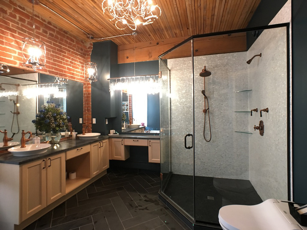 Large eclectic master bathroom in Other with shaker cabinets, light wood cabinets, a drop-in tub, a corner shower, a one-piece toilet, white tile, mosaic tile, green walls, slate floors, a vessel sink, soapstone benchtops, black floor, a hinged shower door and green benchtops.