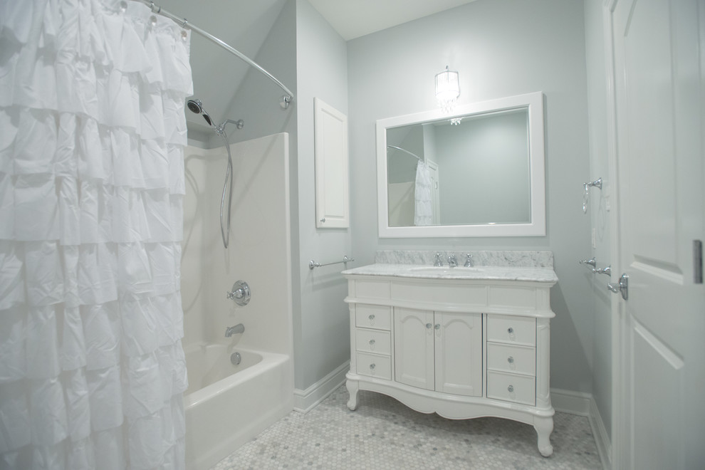 This is an example of a large traditional master bathroom in Other with raised-panel cabinets, white cabinets, a freestanding tub, an open shower, a one-piece toilet, gray tile, white tile, stone tile, green walls, terra-cotta floors, a drop-in sink and soapstone benchtops.