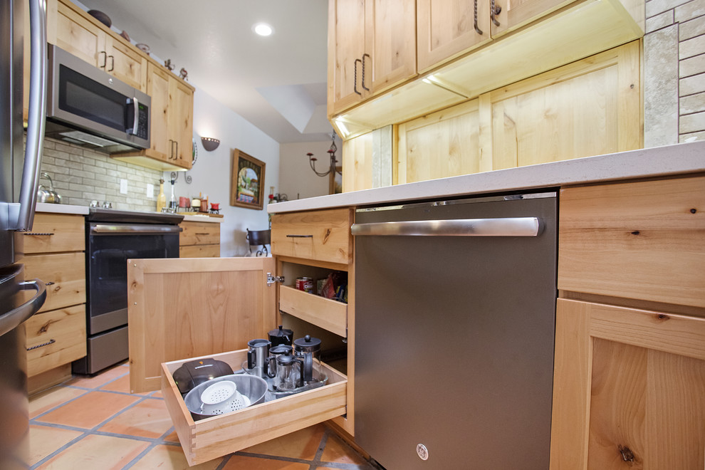 Example of a small mountain style l-shaped kitchen design in Phoenix with shaker cabinets, quartz countertops, beige backsplash, stainless steel appliances, no island and white countertops