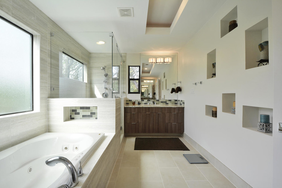 This is an example of a contemporary master bathroom in Austin with an undermount sink, flat-panel cabinets, dark wood cabinets, a drop-in tub, a corner shower, multi-coloured tile, mosaic tile and white walls.