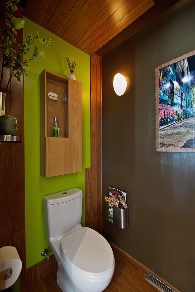 Photo of a mid-sized contemporary powder room in Chicago with flat-panel cabinets, light wood cabinets, a one-piece toilet, mosaic tile, brown walls, bamboo floors and an integrated sink.
