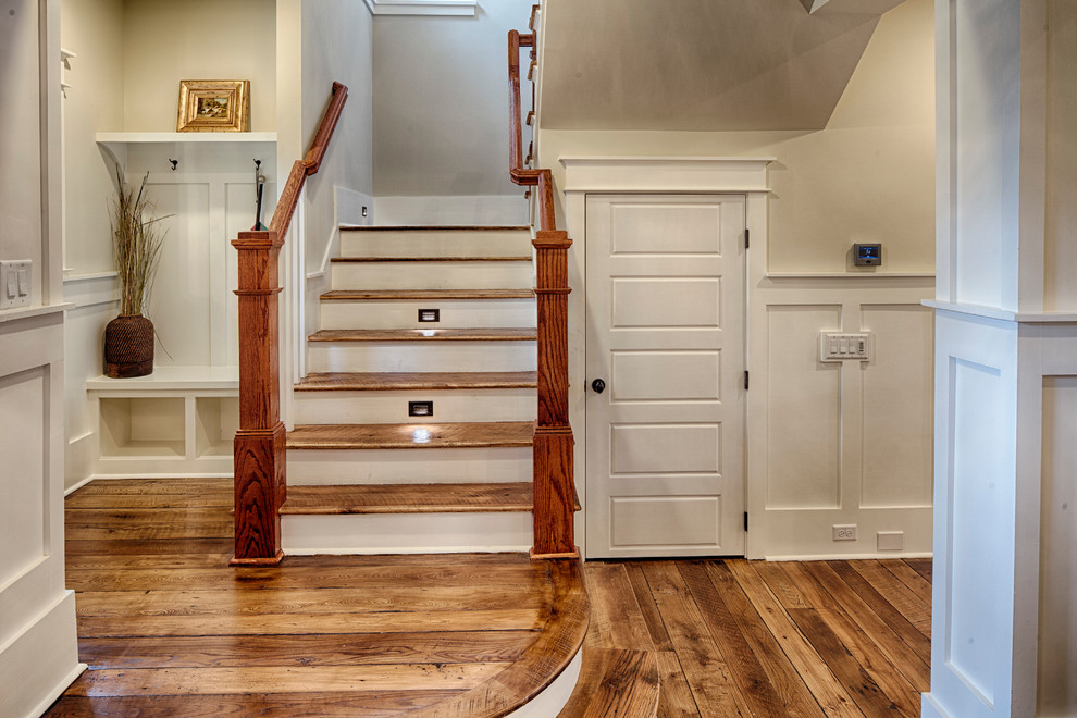 Photo of a large traditional foyer in Charleston with beige walls and medium hardwood floors.