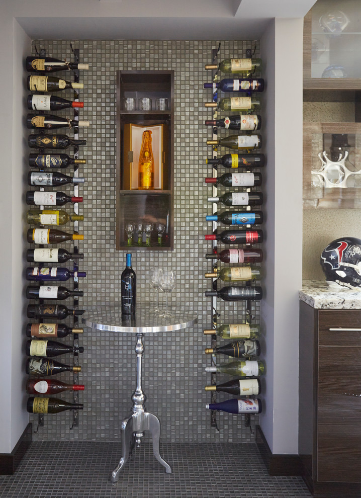 This is an example of a small contemporary wine cellar in Houston with storage racks.