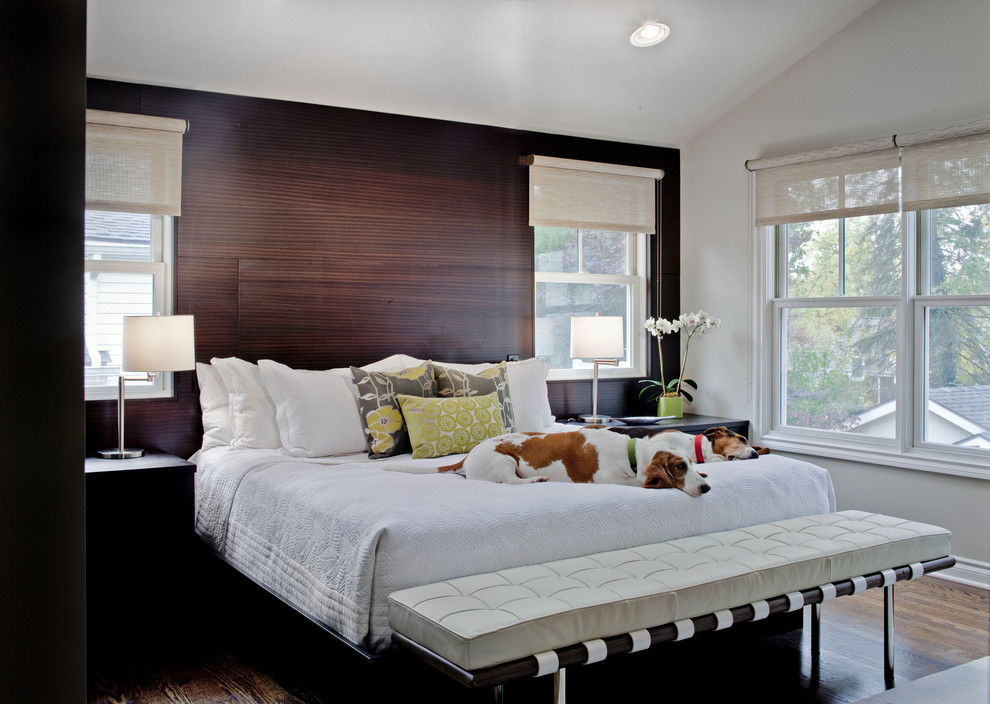 Design ideas for a contemporary bedroom in Detroit with white walls and medium hardwood floors.