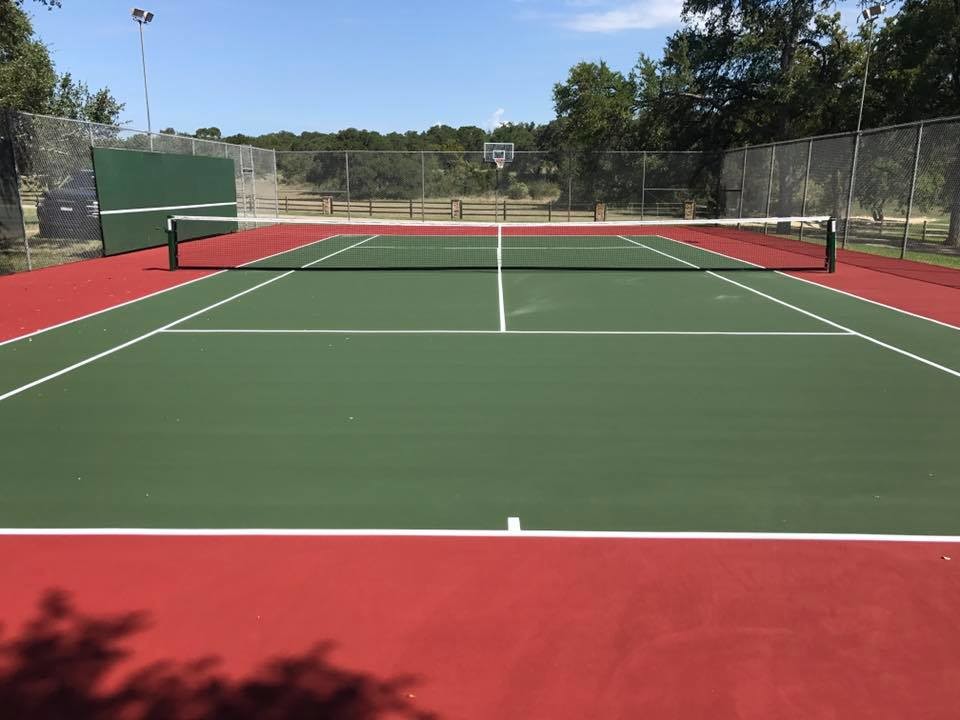 Design ideas for a large traditional backyard partial sun outdoor sport court for summer in Austin with with outdoor playset and concrete pavers.
