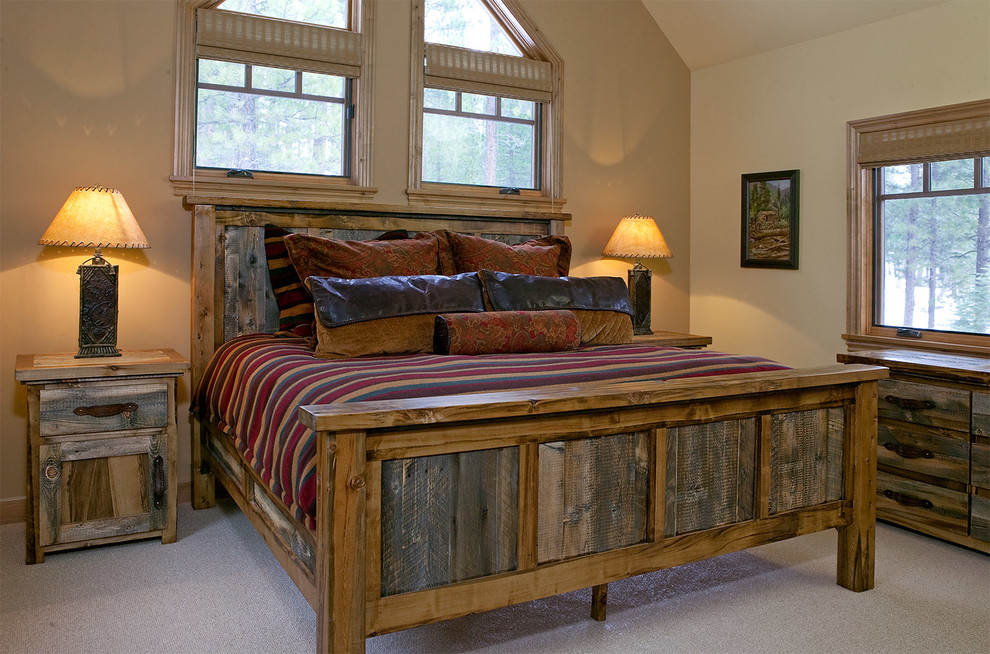 Inspiration for a large rustic master carpeted bedroom remodel with beige walls and no fireplace