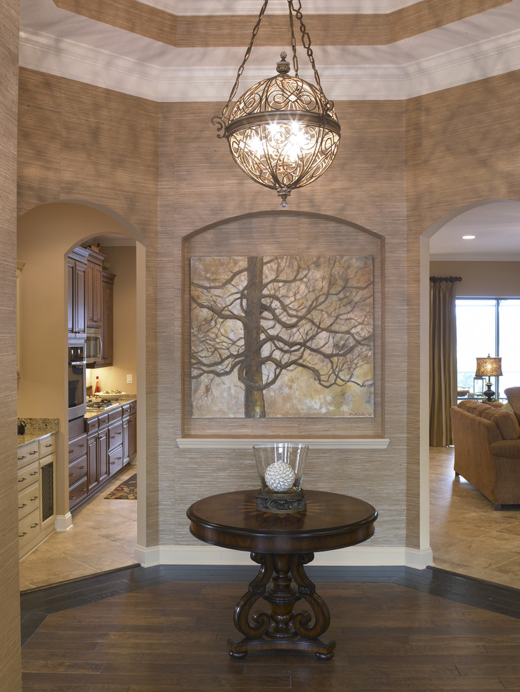 Photo of a traditional entryway in Jacksonville with beige walls and dark hardwood floors.