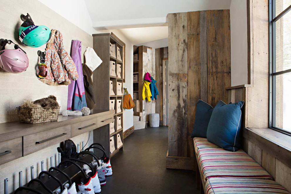 Inspiration for a rustic concrete floor mudroom remodel in Birmingham