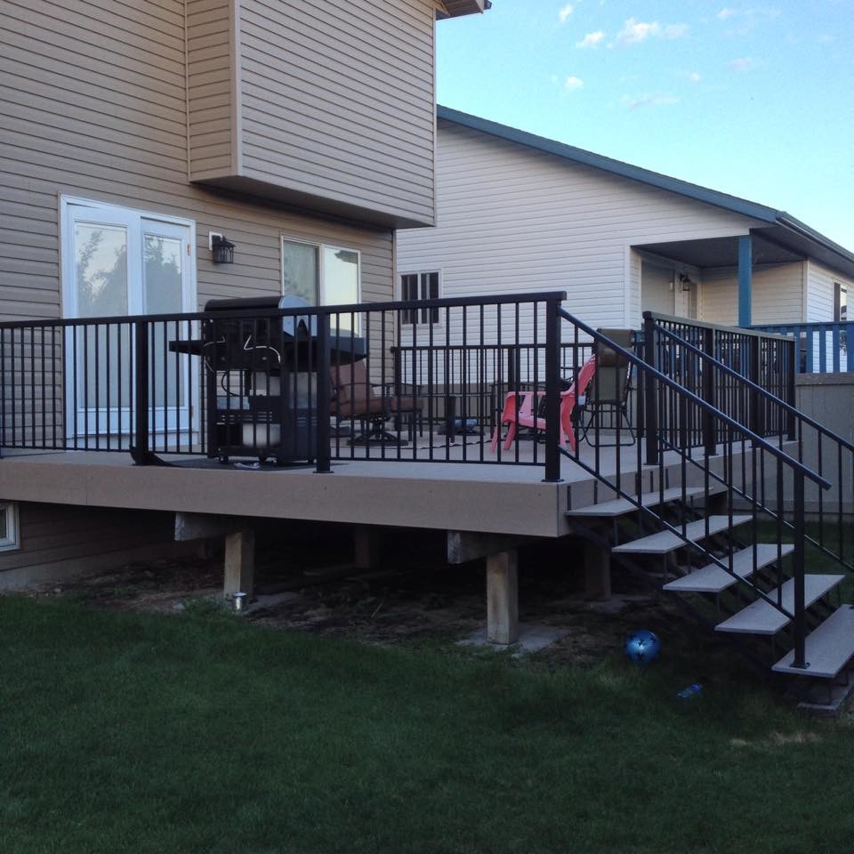 This is an example of a mid-sized contemporary backyard deck in Calgary.
