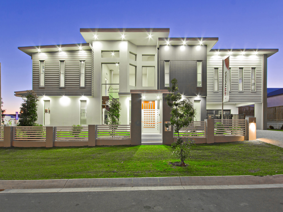 Large modern two-storey grey exterior in Brisbane with mixed siding and a flat roof.