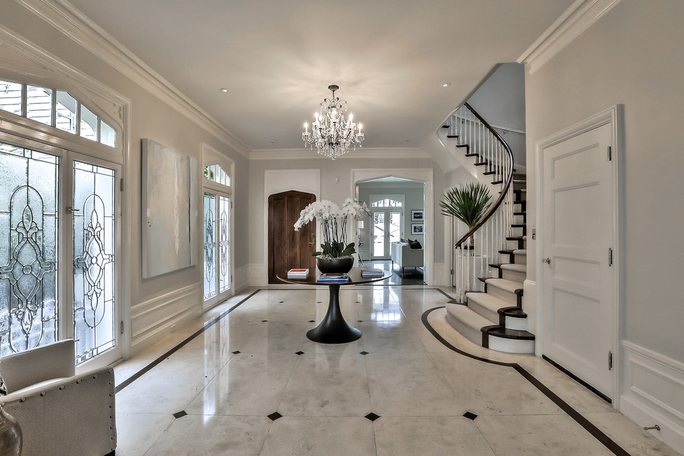 Large transitional foyer in San Francisco with grey walls, marble floors, a double front door, a glass front door and white floor.