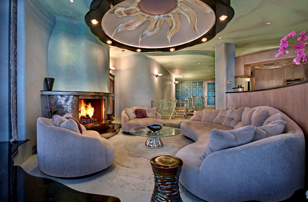 Example of an eclectic formal and open concept living room design in Orange County with blue walls, a standard fireplace and no tv