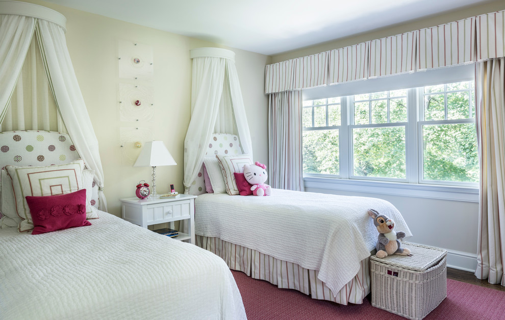 Traditional kids' bedroom in Providence with beige walls and dark hardwood floors for kids 4-10 years old and girls.