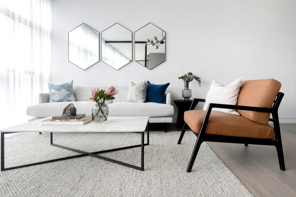 This is an example of a large contemporary living room in Sydney with white walls.