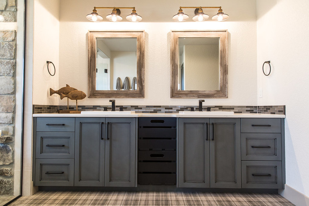 Expansive transitional master wet room bathroom in Other with shaker cabinets, grey cabinets, a freestanding tub, a two-piece toilet, multi-coloured tile, glass tile, multi-coloured walls, ceramic floors, a drop-in sink, engineered quartz benchtops, multi-coloured floor, a hinged shower door and white benchtops.