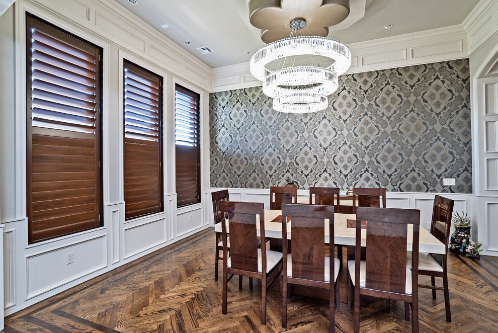 Mid-sized mediterranean separate dining room in Oklahoma City with multi-coloured walls, dark hardwood floors, no fireplace, brown floor, recessed and decorative wall panelling.