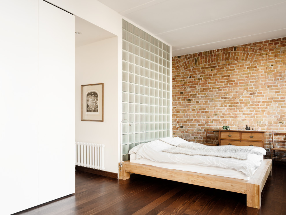 Inspiration for a mid-sized contemporary bedroom in Berlin with brown walls, dark hardwood floors and no fireplace.