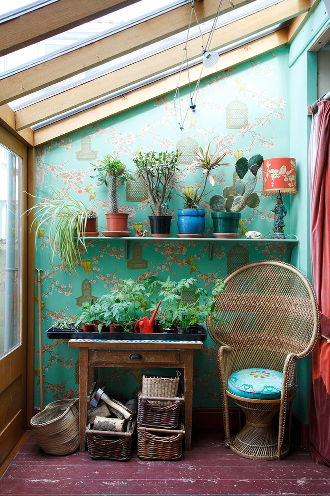 Photo of a traditional sunroom in London with a glass ceiling.