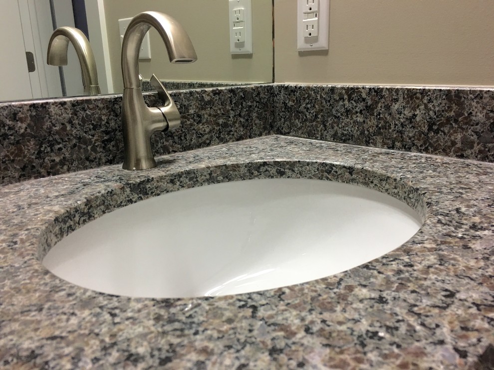 Large transitional master bathroom photo with recessed-panel cabinets, white cabinets, beige walls, an undermount sink and granite countertops