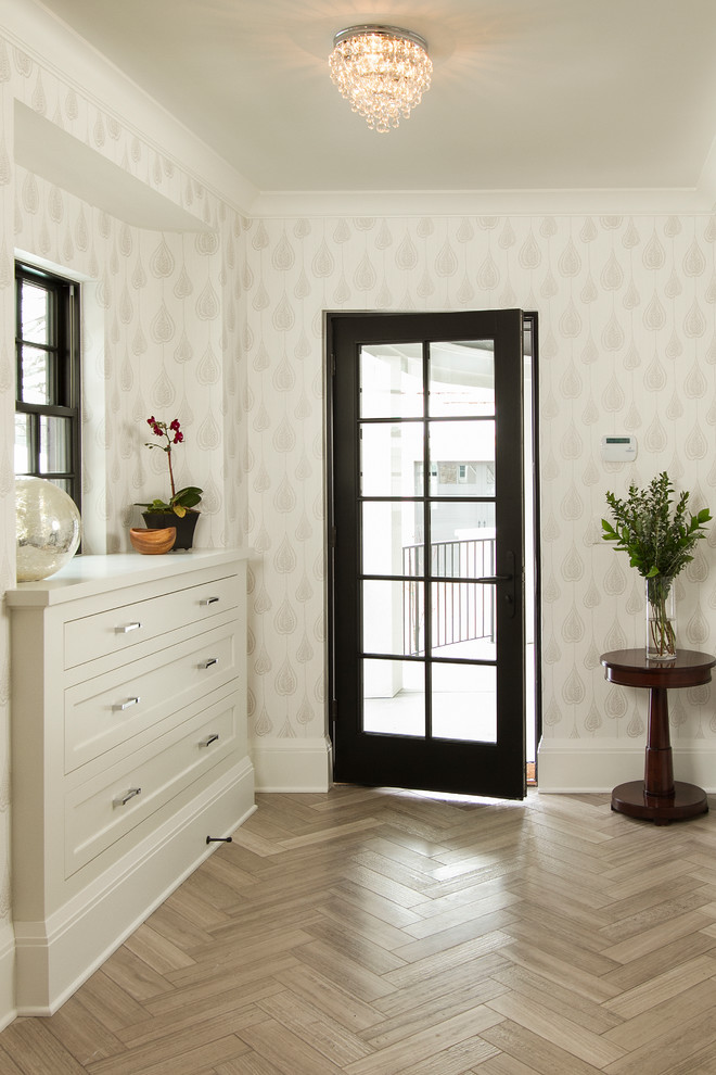 Inspiration for a traditional mudroom in Minneapolis with white walls and a black front door.