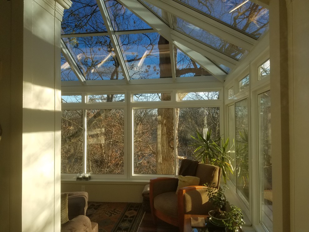 Design ideas for a mid-sized traditional sunroom in Boston with medium hardwood floors and a glass ceiling.