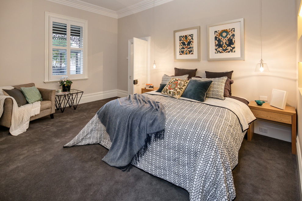 Inspiration for a large master bedroom in Melbourne with white walls and carpet.