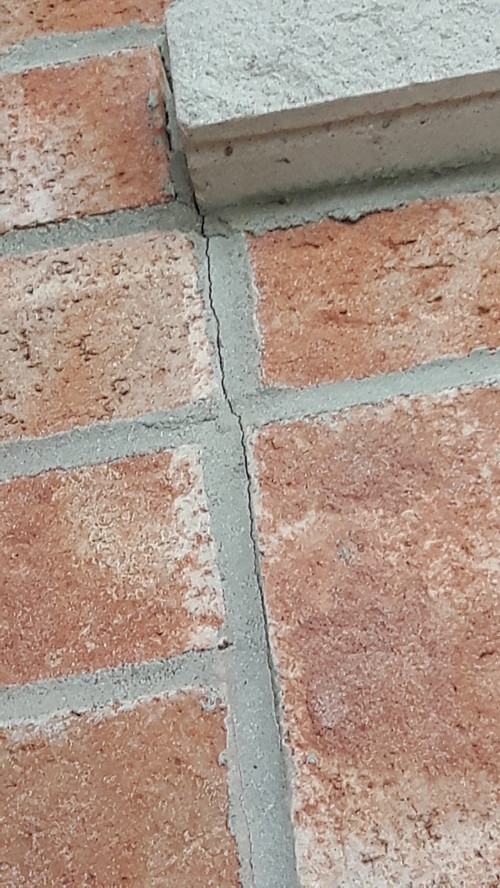 Cracks in mortar between bricks and joints in window sills