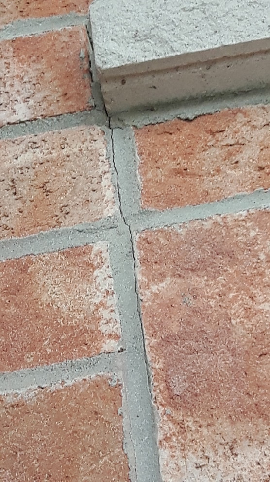 Cracks in mortar between bricks and joints in window sills