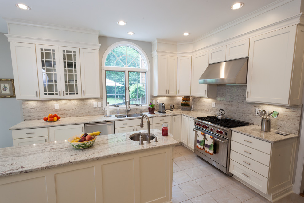 Design ideas for a large traditional l-shaped eat-in kitchen in DC Metro with an undermount sink, recessed-panel cabinets, white cabinets, stainless steel appliances, ceramic floors and with island.