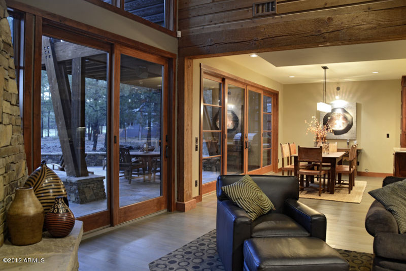 Great room - mid-sized rustic light wood floor and gray floor great room idea with beige walls