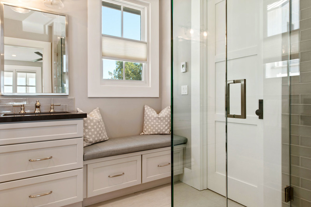 Design ideas for a mid-sized country bathroom in San Francisco with recessed-panel cabinets, grey cabinets, gray tile, subway tile, grey walls, porcelain floors, an undermount sink and engineered quartz benchtops.