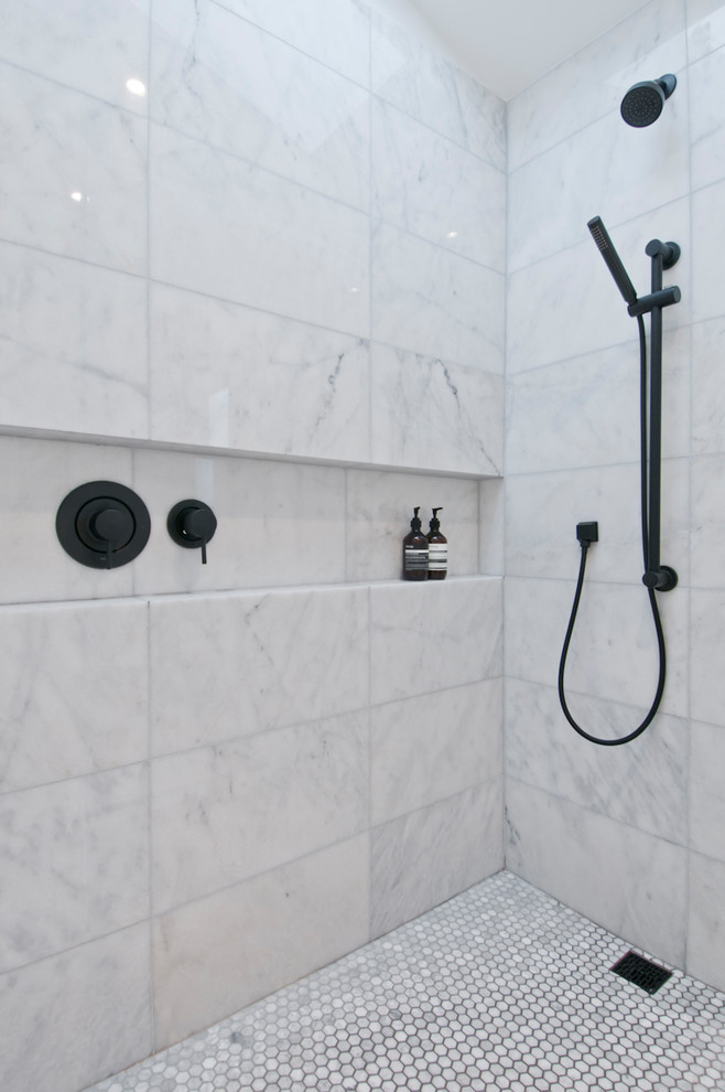 This is an example of a small modern master bathroom in Los Angeles with flat-panel cabinets, light wood cabinets, an open shower, a one-piece toilet, white tile, marble, white walls, concrete floors, a drop-in sink, engineered quartz benchtops, grey floor, an open shower and white benchtops.