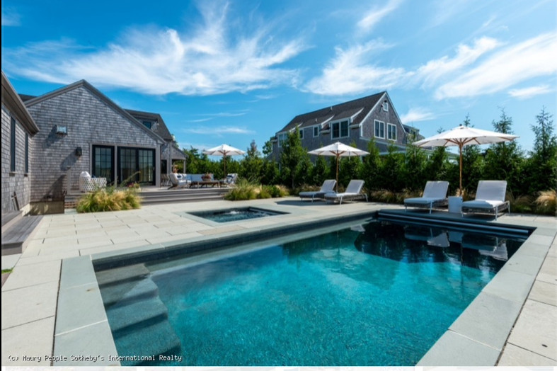 Example of a beach style pool design in Cleveland