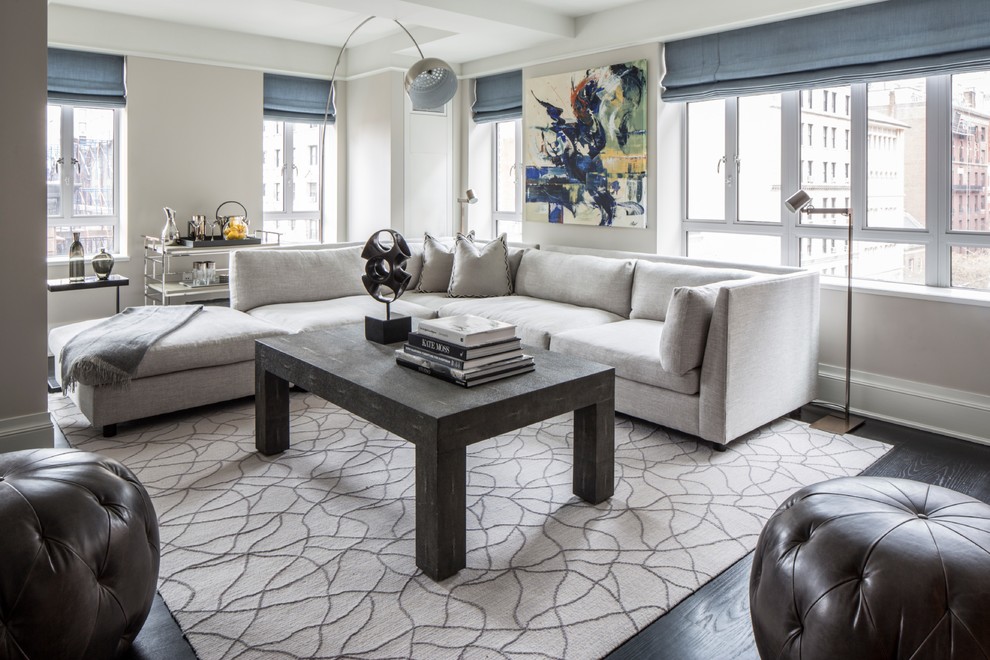 Inspiration for a transitional open concept living room in New York with grey walls and dark hardwood floors.