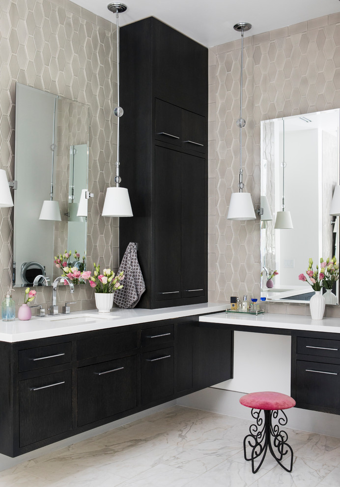 This is an example of a large contemporary master bathroom in San Francisco with flat-panel cabinets, dark wood cabinets, a freestanding tub, a one-piece toilet, white tile, marble, grey walls, marble floors, an undermount sink, marble benchtops, white floor, a hinged shower door and white benchtops.