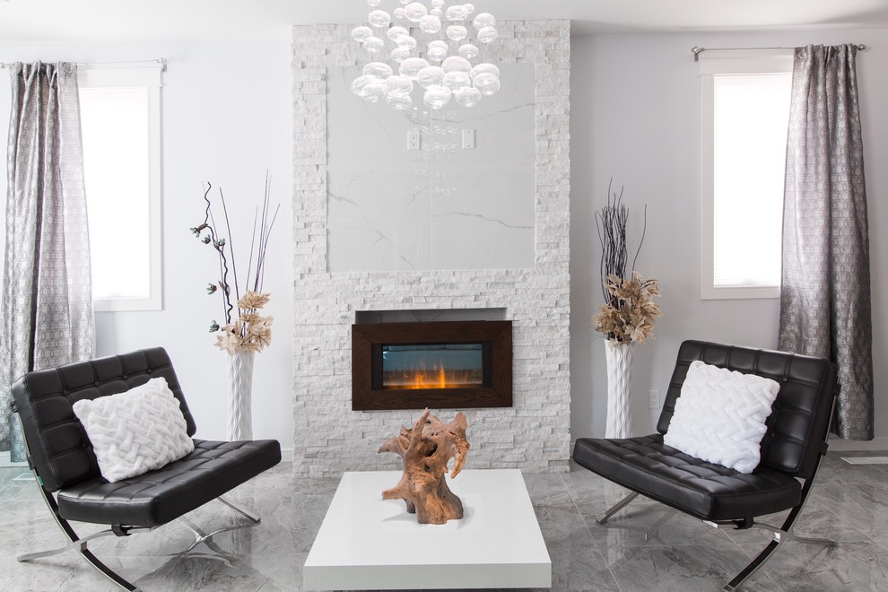 Inspiration for a mid-sized modern open concept living room in Edmonton with grey walls, porcelain floors, a standard fireplace, a stone fireplace surround and no tv.