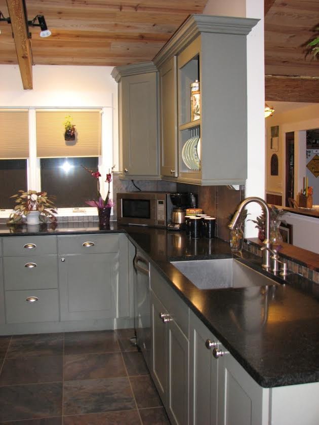 Mid-sized transitional l-shaped porcelain tile kitchen photo with an undermount sink, shaker cabinets, gray cabinets, granite countertops, brown backsplash, ceramic backsplash and stainless steel appliances