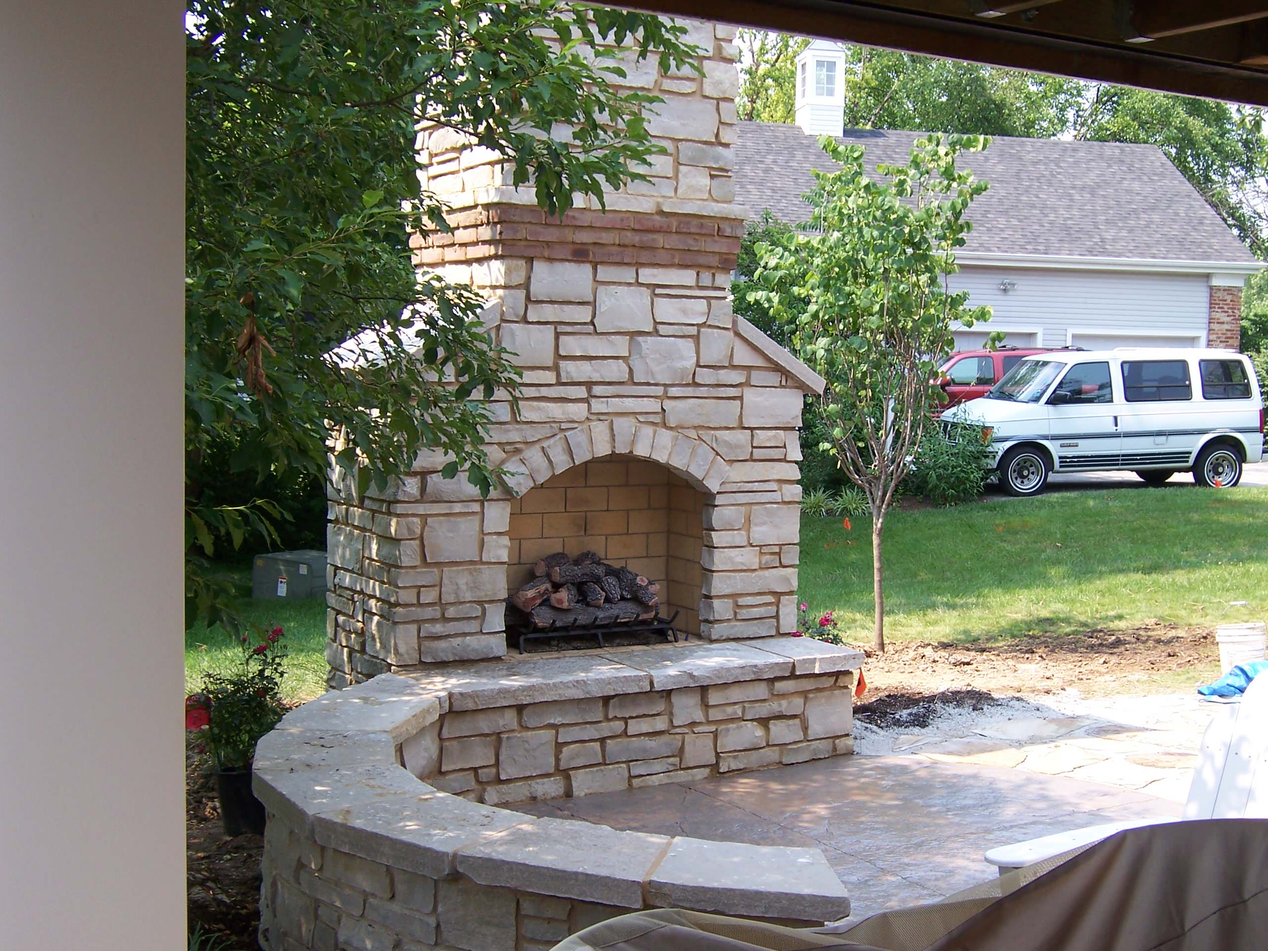 Lake St Louis, Missouri Outdoor Stone Masonry (Gas) Fireplace with Brick Banding