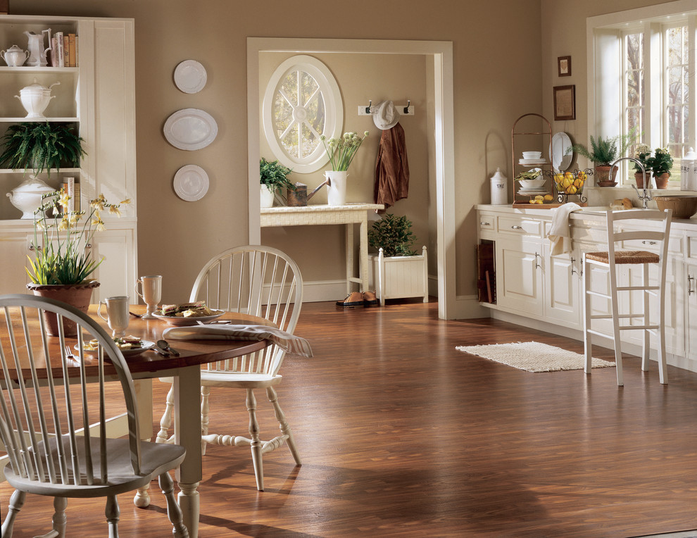 Inspiration for a transitional single-wall vinyl floor eat-in kitchen remodel in Miami with raised-panel cabinets and white cabinets