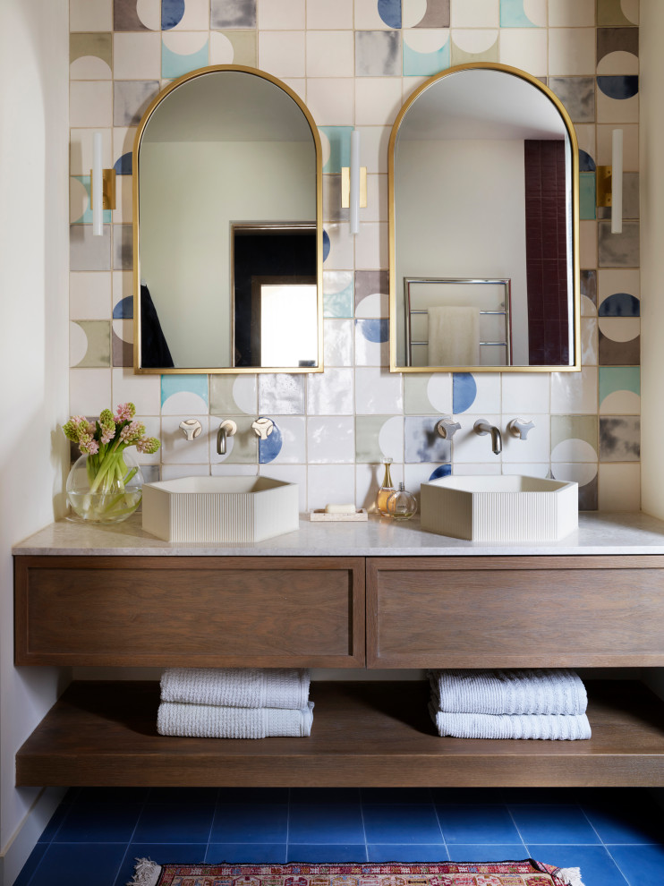 Inspiration for a midcentury bathroom in Other with dark wood cabinets, multi-coloured tile, ceramic tile, ceramic floors, a console sink, engineered quartz benchtops, blue floor, a double vanity, a built-in vanity and shaker cabinets.