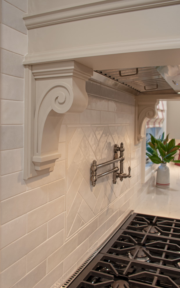 Eat-in kitchen - transitional eat-in kitchen idea with shaker cabinets, beige cabinets, quartz countertops, white backsplash, ceramic backsplash, stainless steel appliances and white countertops