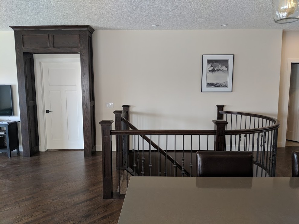 Example of a mid-sized classic wooden mixed material railing staircase design in Calgary